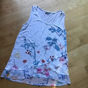 White sleeveless top.